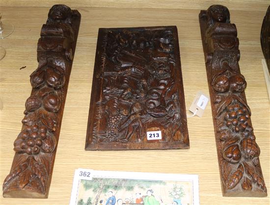 A Flemish small semi-relief carved oak panel of Abraham and Isaac and two carved oak terms length 59.5cm